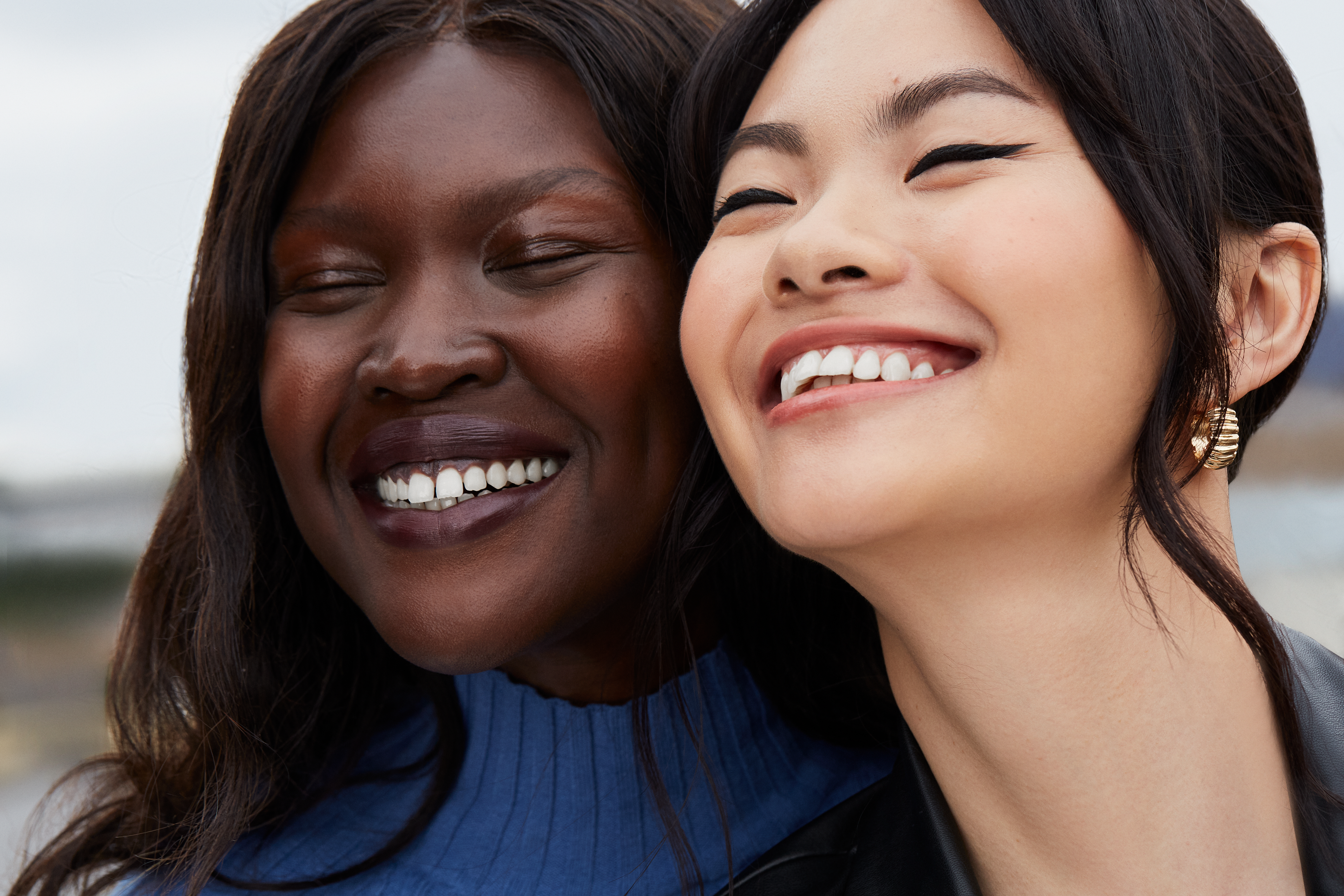 group img. 2 female models with clear skin laughing together