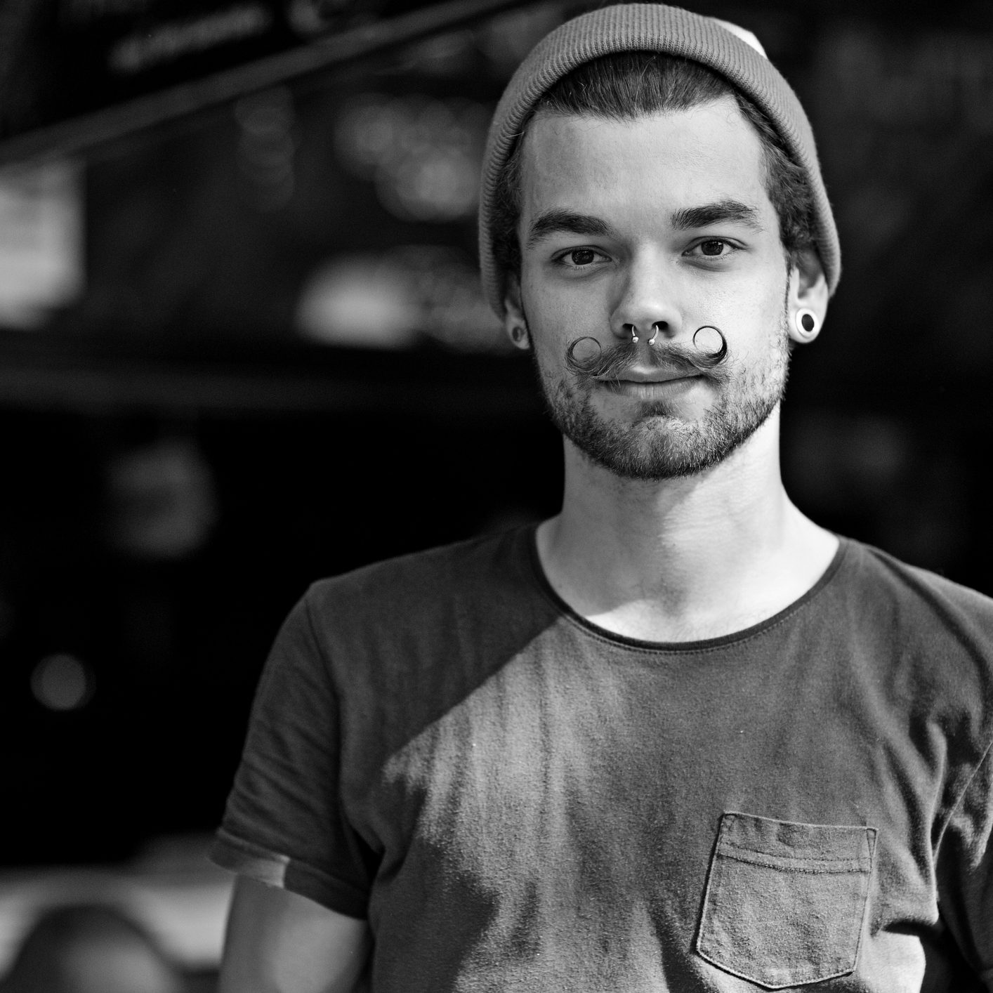 portrait of waiter with styled moustaches