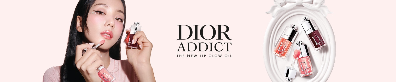 Huile à lèvres Dior Addict en teintes brillantes, présentée dans un élégant flacon.